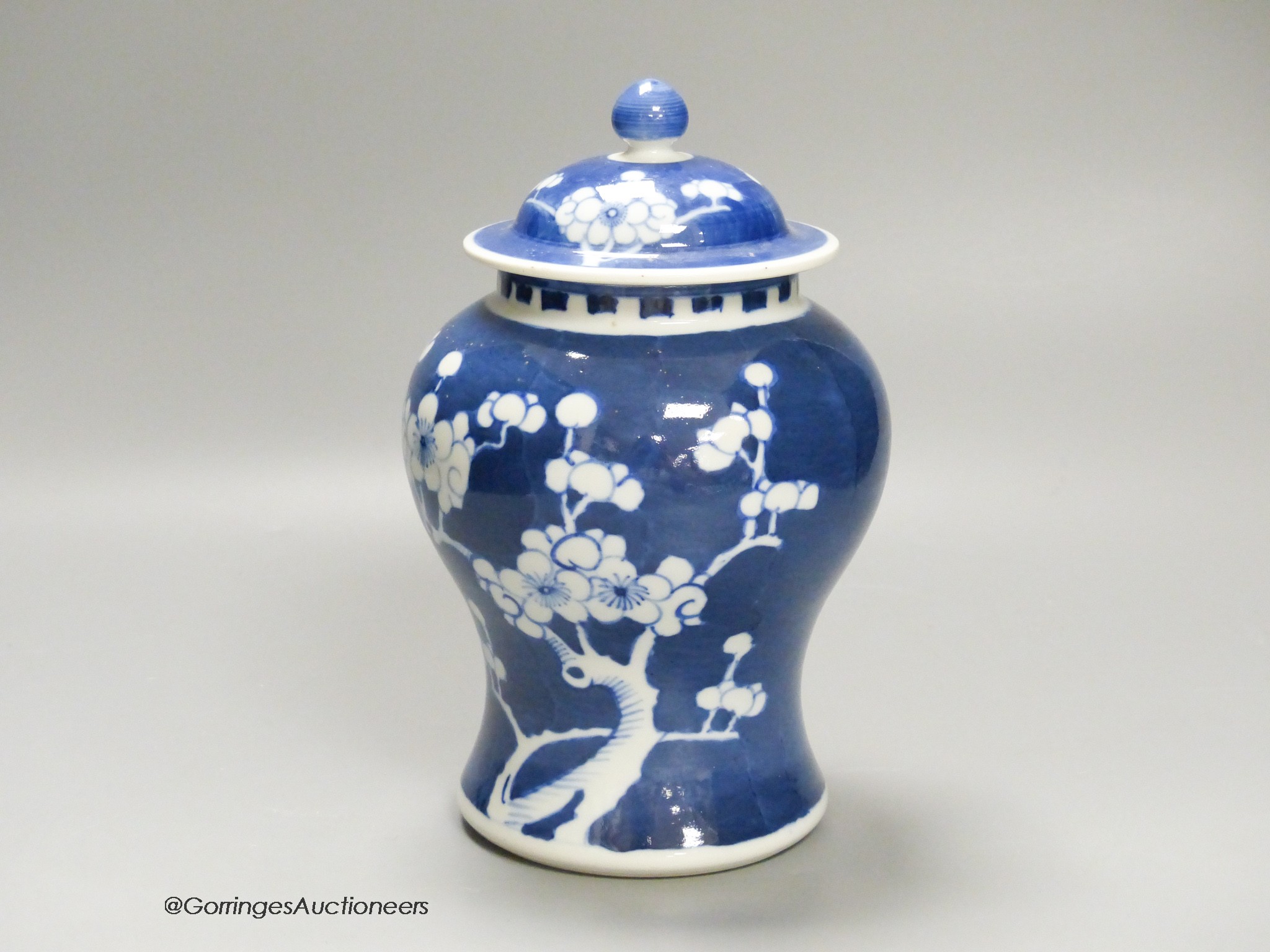 A Chinese blue and white 'prunus' jar and cover, height 22cm